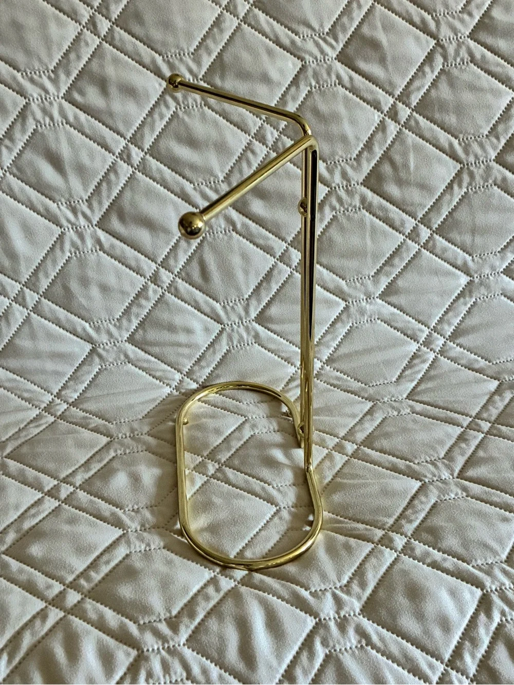 Vintage gold-tone metal countertop vanity hand towel stand